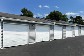 a row of garage doors on the side of a building at Deercross Apartments, Cincinnati, Ohio